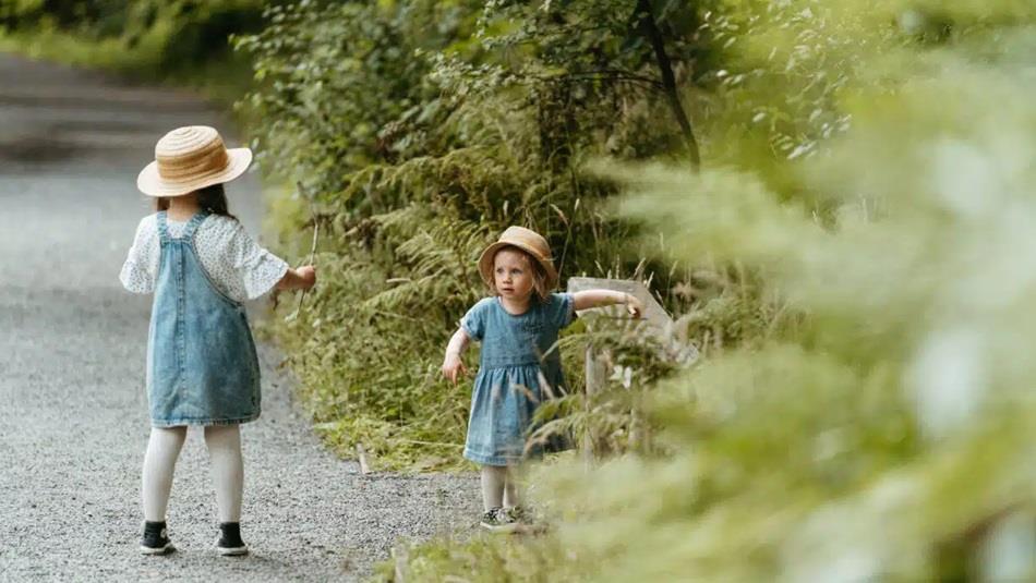 Two children walking the trail