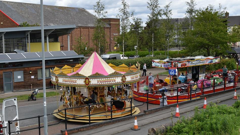 A fairground on the street.