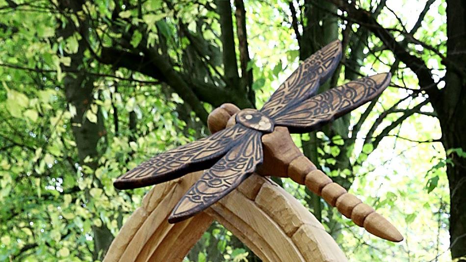 Carved wooden sculpture depicting a Dragonfly