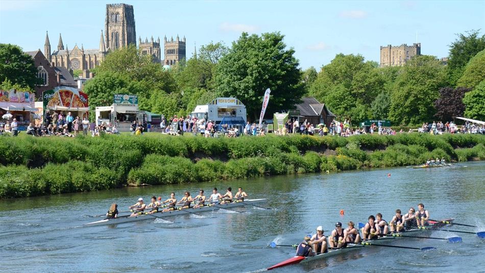 Teams of eight racing at Durham Regatta on a beautiful sunny day against the backdrop of Durham Cathedral and Castle.