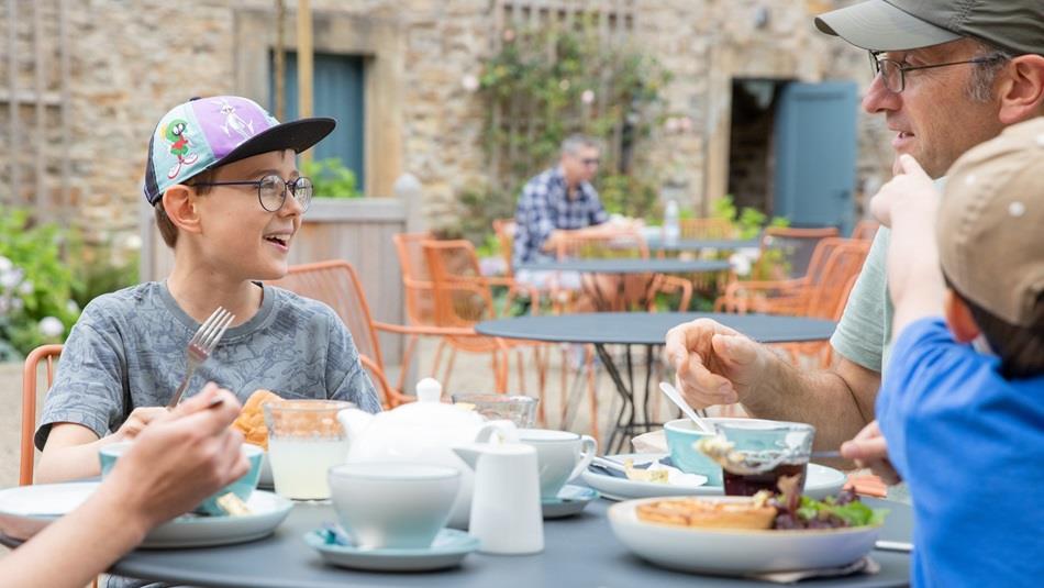 Father’s Day at Auckland Palace. A father and his two sons enjoying 'Gentleman's Afternoon Tea'.