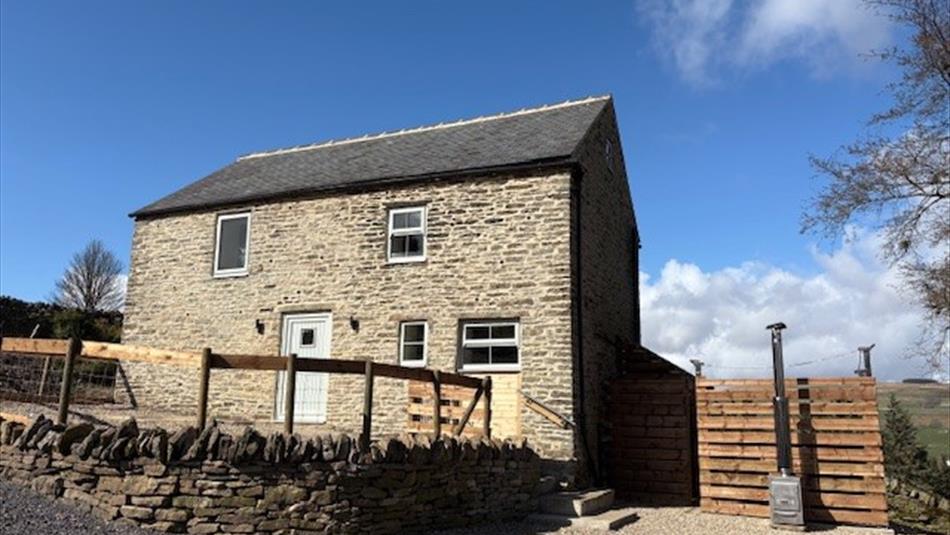 Front of barn with hot tub
