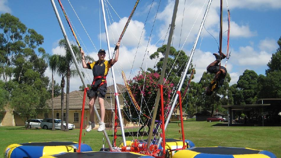 people on bungee trampolines at Fun in the Park event.