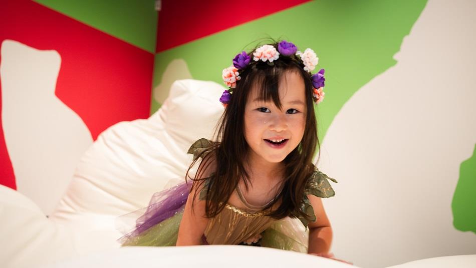 A little girl wearing a fairy outfit playing on squishees in Pippa Hale Pet Project