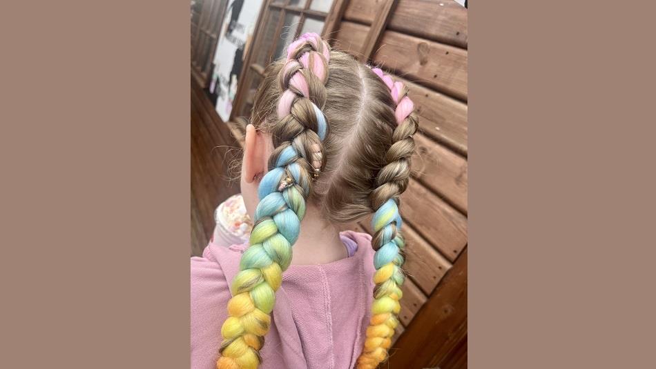 Child with colourful hair braids