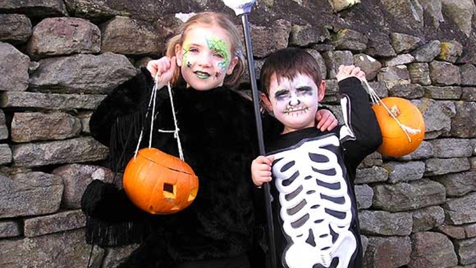Two children dressed in Halloween costumes at Hall Hill Farm