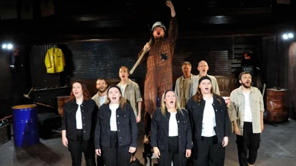 A group of performers singing.