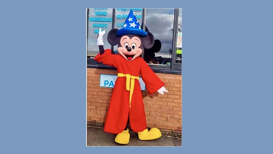 Someone dressed as a Mickey Mouse Wizard