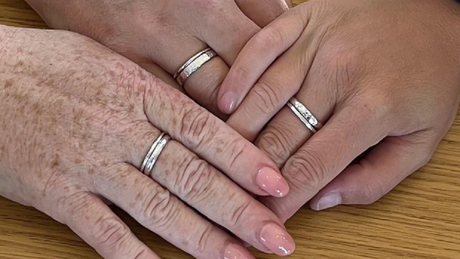 Hands displaying silver stacking rings