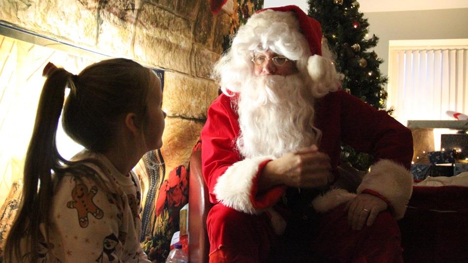 A girl meets Santa, Christmas Tree and fireplace