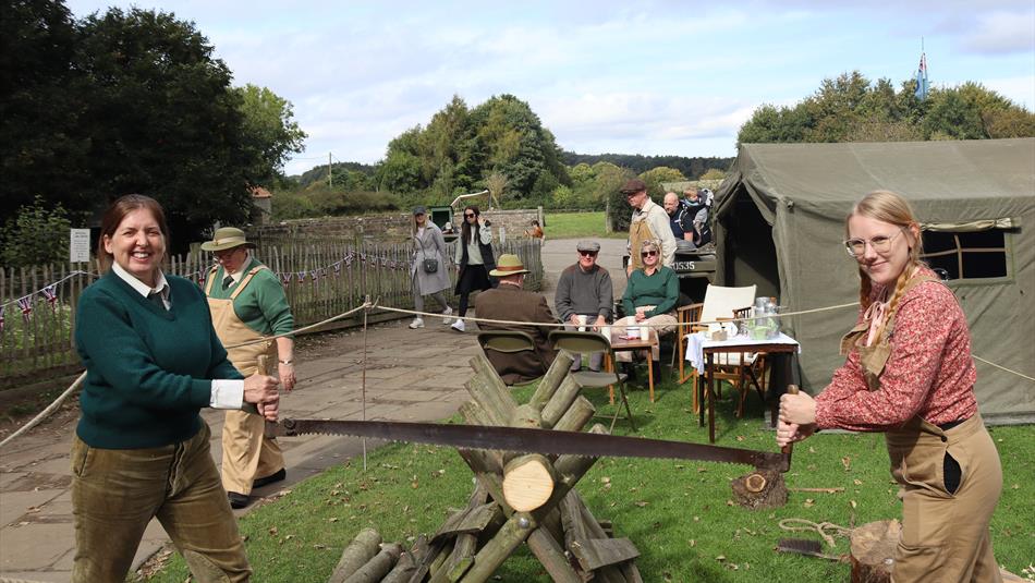 Two people sawing a log - Beamish Museum