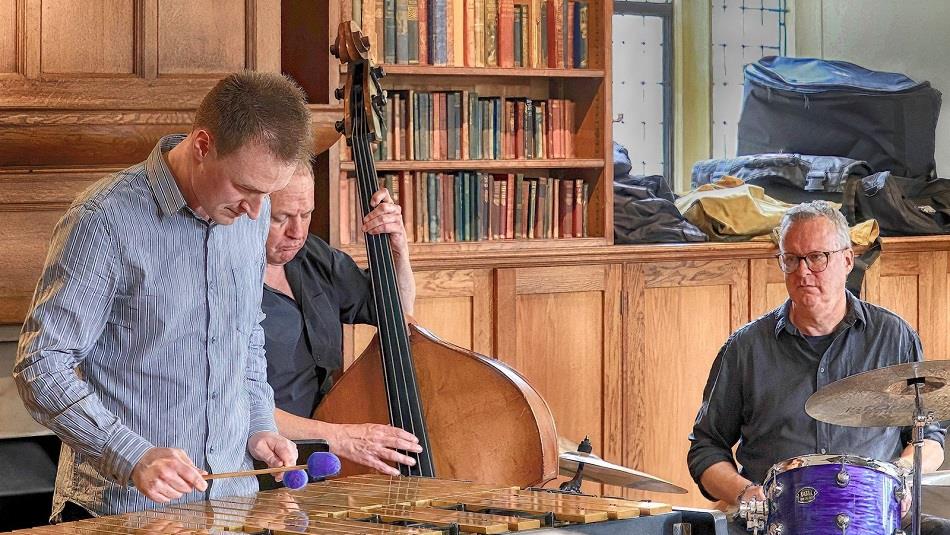 three members of Bishop Auckland jazz playing instruments