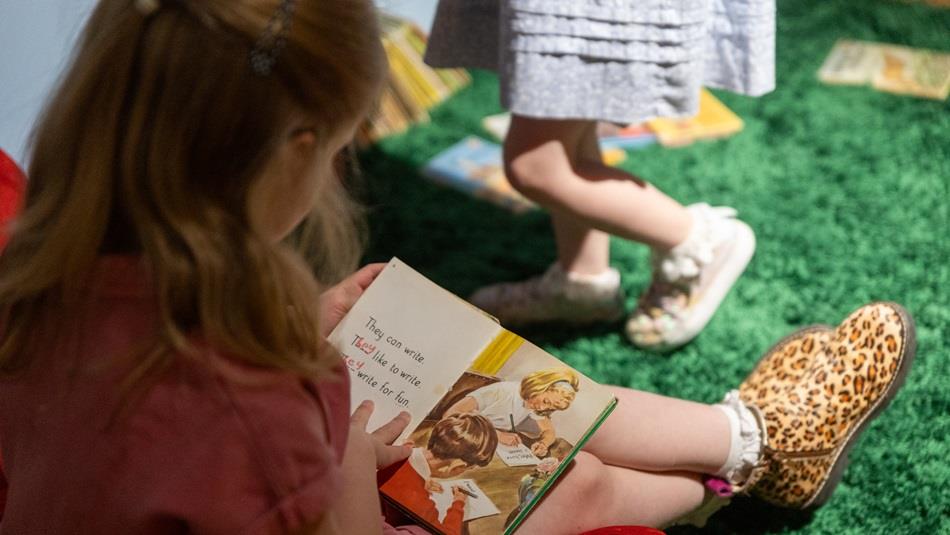 Child reading a Ladybird book