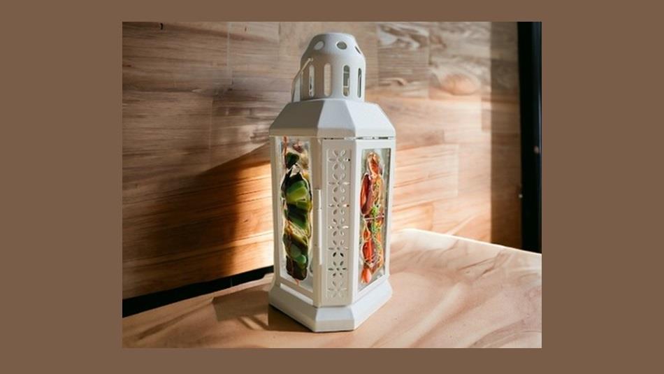 A fused glass autumn lantern
