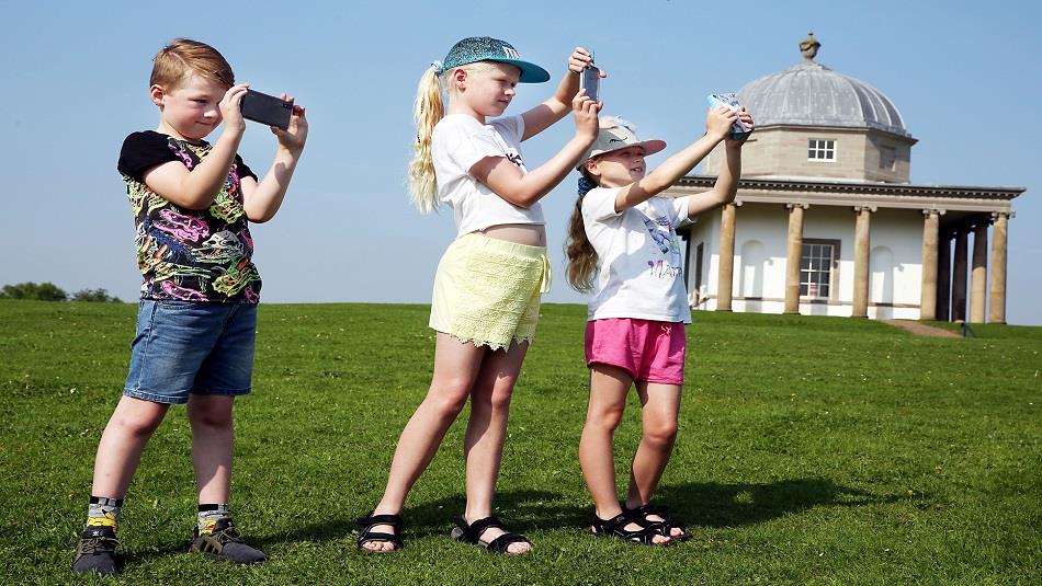 Three children at Hardwick Park using App