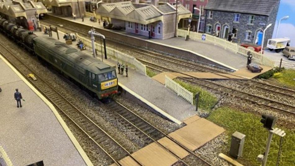 A model railway including train and station.