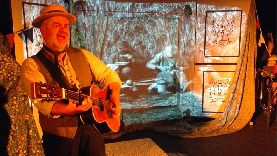 A man playing a guitar.