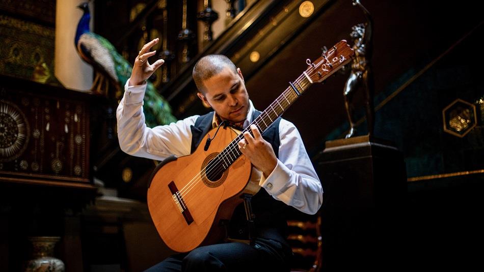 Samuel Moore playing the guitar