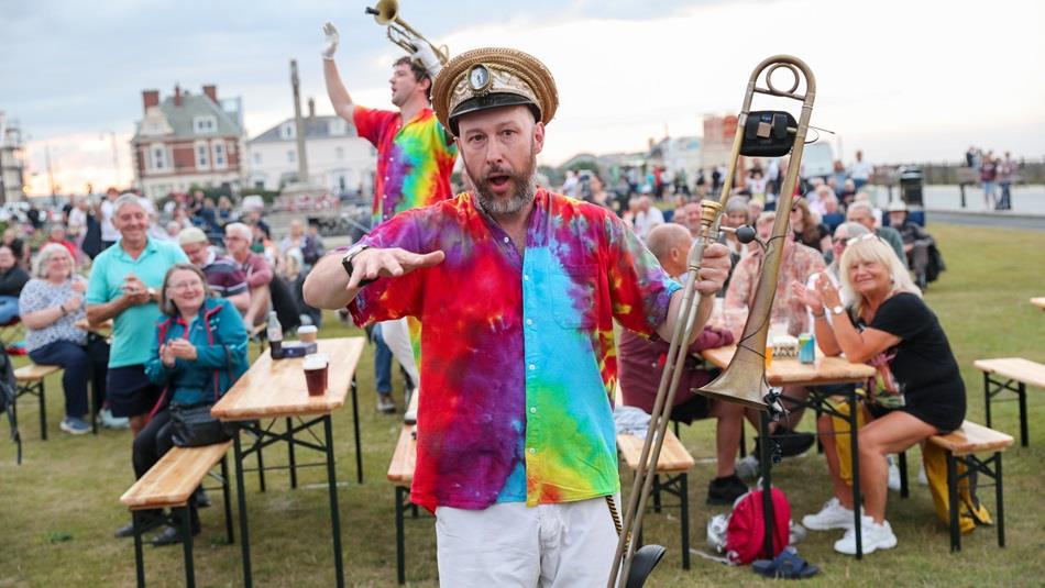 Musicians dancing and playing for the crowd at Seaham Brass Bash - Durham Brass Festival in 2025.