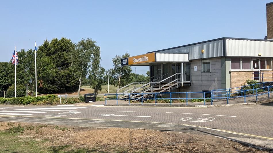 View of the entrance to Sevenhills on a sunny day.