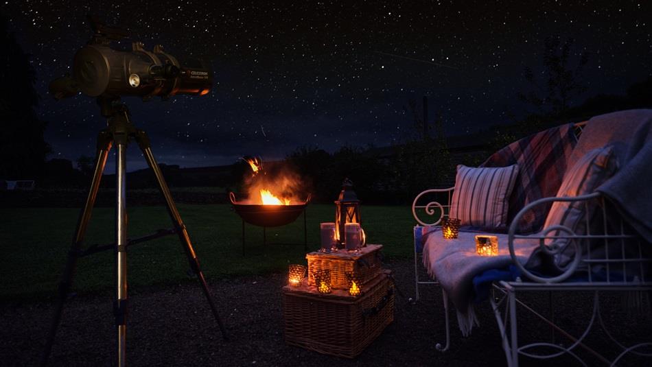 Outdoor seating, fire pit, picnic hamper, a starry dark sky