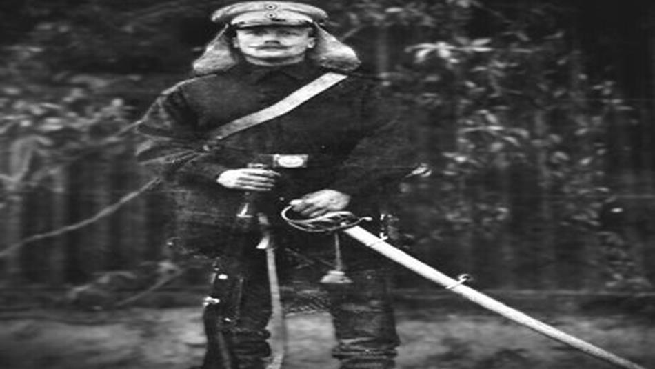 Black and white photo of a soldier in uniform, with weapons - Bowburn Medal and Militaria Fair