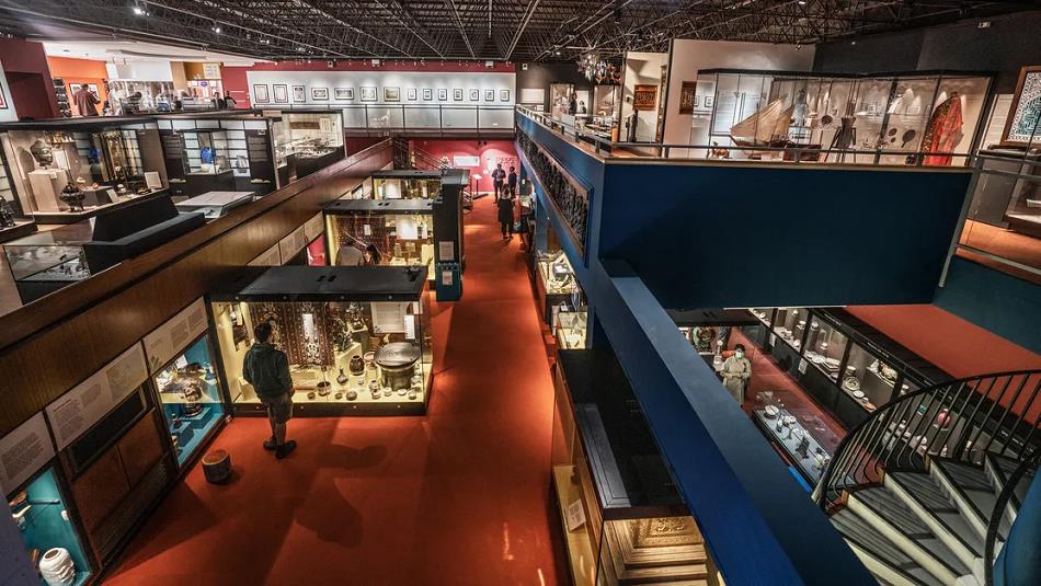 Birdseye view of people browsing the Oriental Museum galleries.