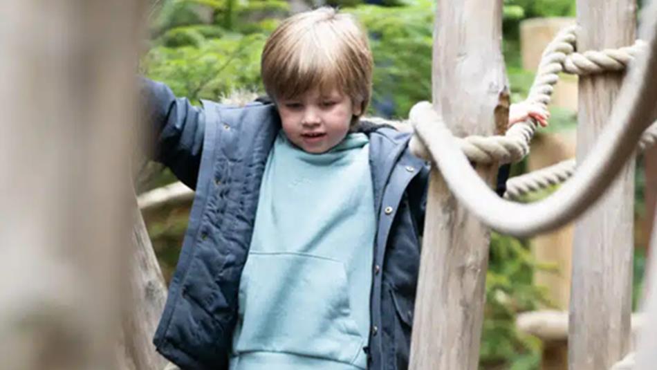 Child walking over play equipment at Plotters' Forest - Raby Castle, Park and Gardens.