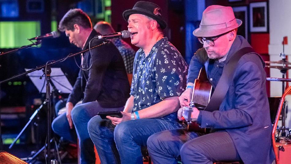 Jimmy Regal and The Royals performing on stage.