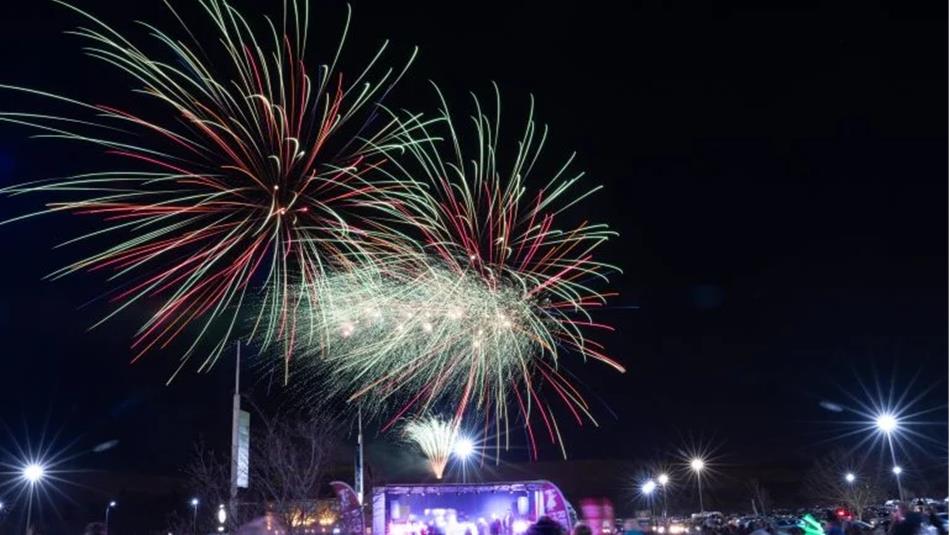 Fireworks at Dalton Park Outlet & Outdoors and crowds below.