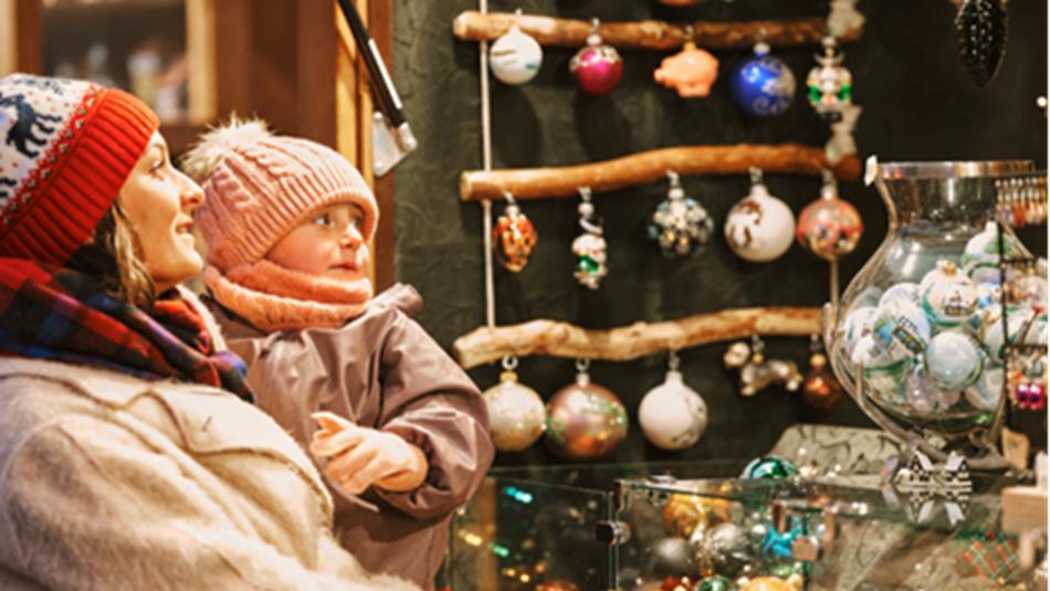Mother and baby looking at baubles at the Christmas Market, Lumley Castle.