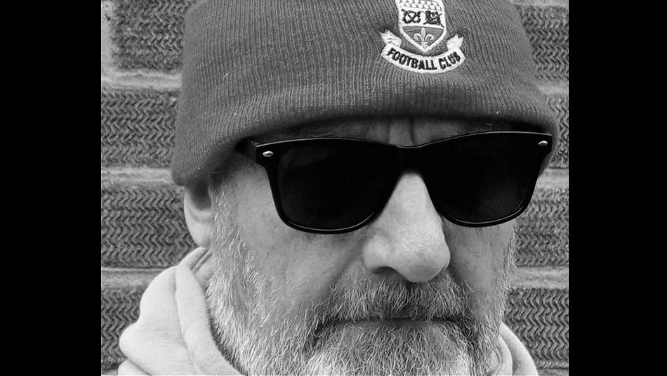 Close up shot of Andy Gilbert's face in black and white. 

