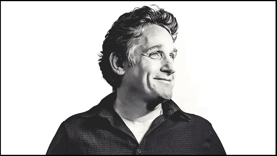 Black and white photo of Tom Stade looking off to the left.