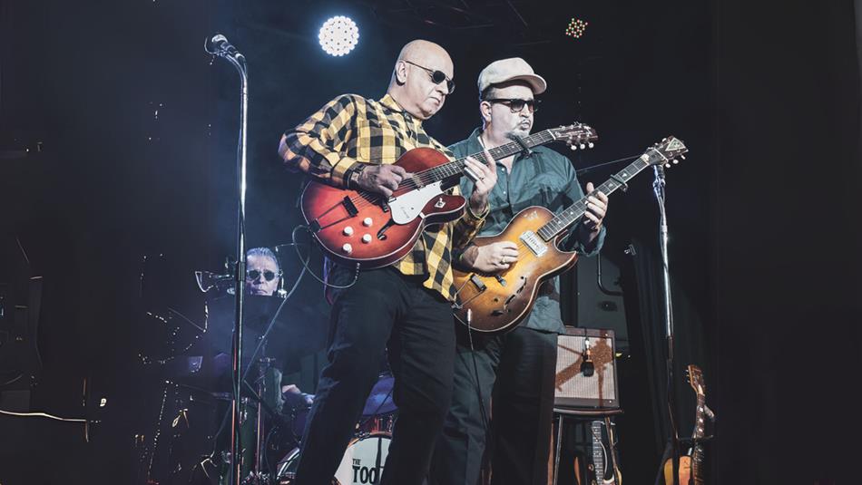 Duo performing with their guitars on stage - The Too Bad Jims