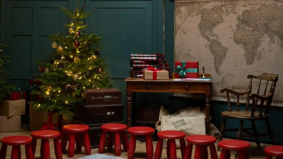 Christmas Tree, writing desk, presents and red stools.