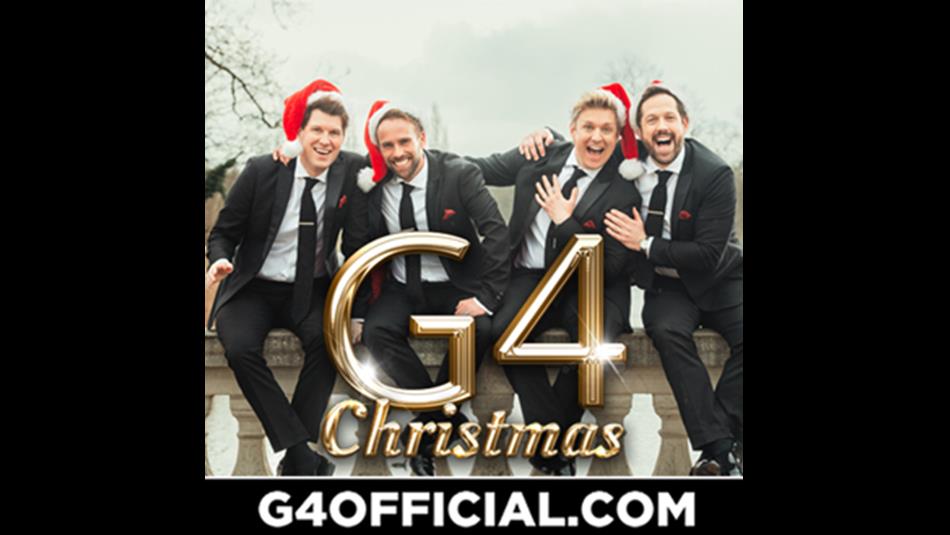 G4 members wearing santa hats and suits.
