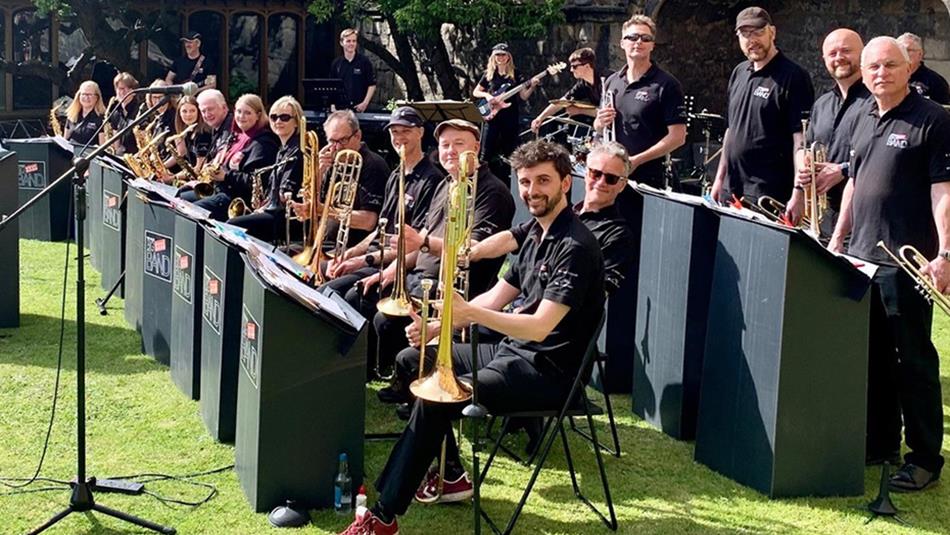 Members of The Tyne Valley Big Band smile for a photo.