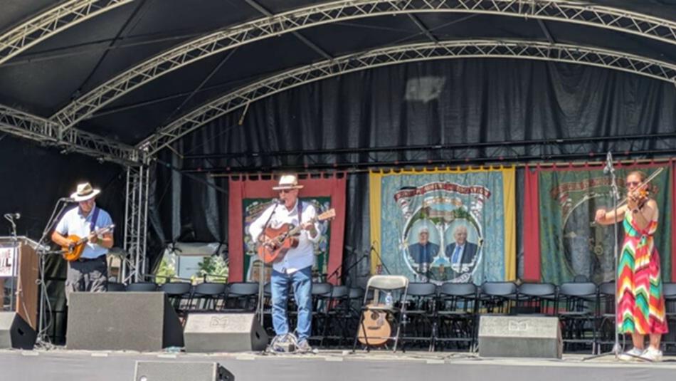 Musicians performing folk music on stage