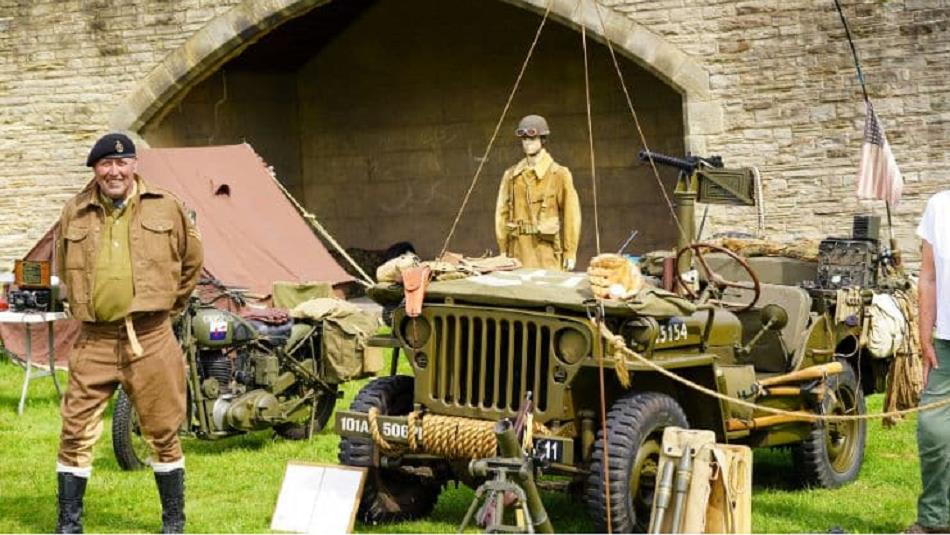 1940s army vehicles and people wearing historical military uniform