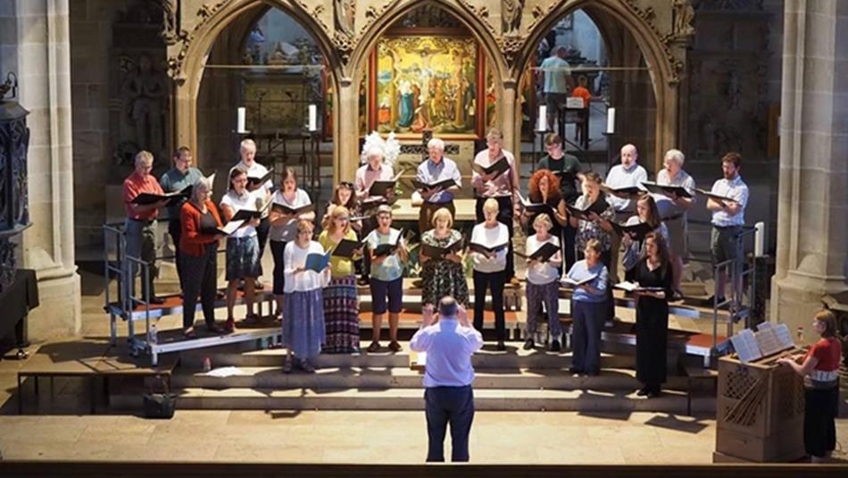 Durham Singers and Northern Spirit Singers performing in a church.