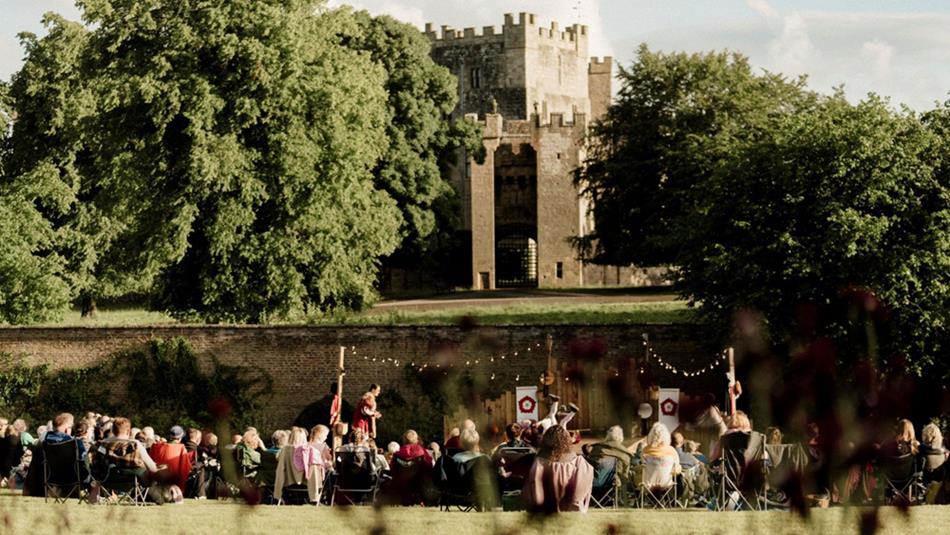 Audience enjoying Open Air Theatre at Raby Castle, Park and Gardens