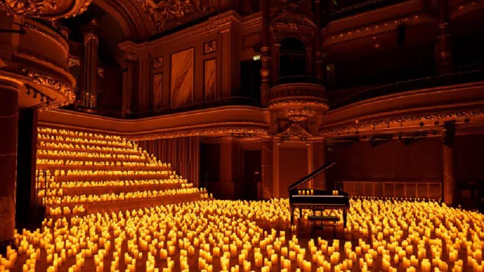 A grand piano in a room with thousands of candles.