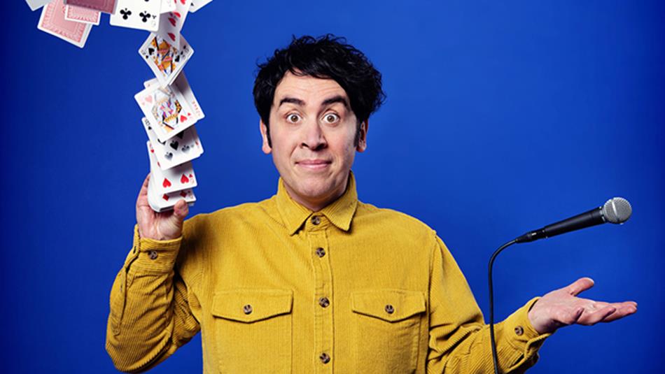 Pete Firman throwing a pack of cards ito the air