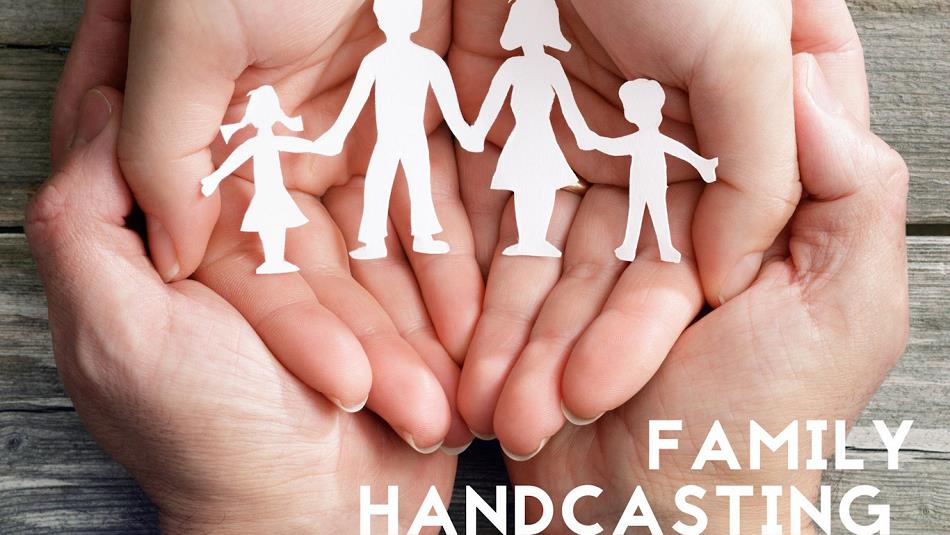 Hands together, holding a cardboard cut out family= family handcasting