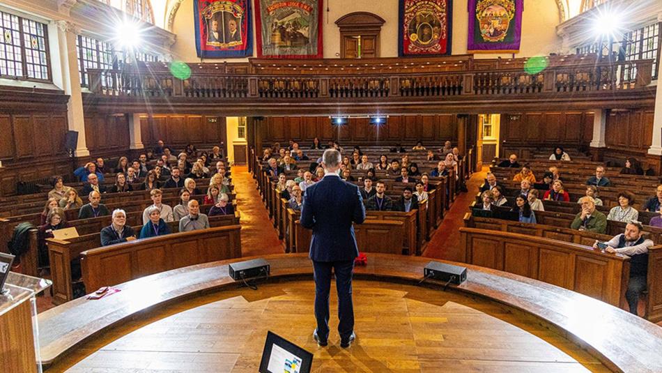 Pitman's Parliament DEI Conference. Speaker addressing audience at Redhills Durham Miners Hall