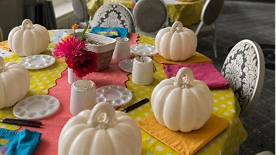 A colourful table prepared for Ceramic Pumpkin Painting.