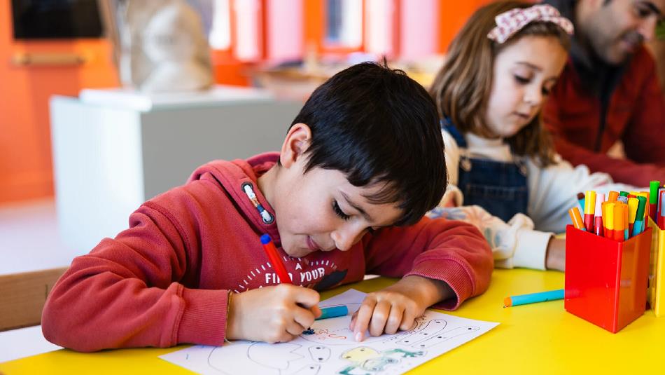 A child enjoying colouring activities at The Bowes Museum  ©TheBowesMuseum