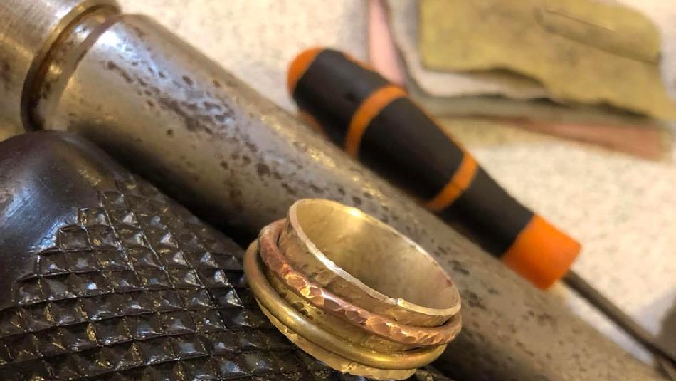 Silver spinner ring and tools.