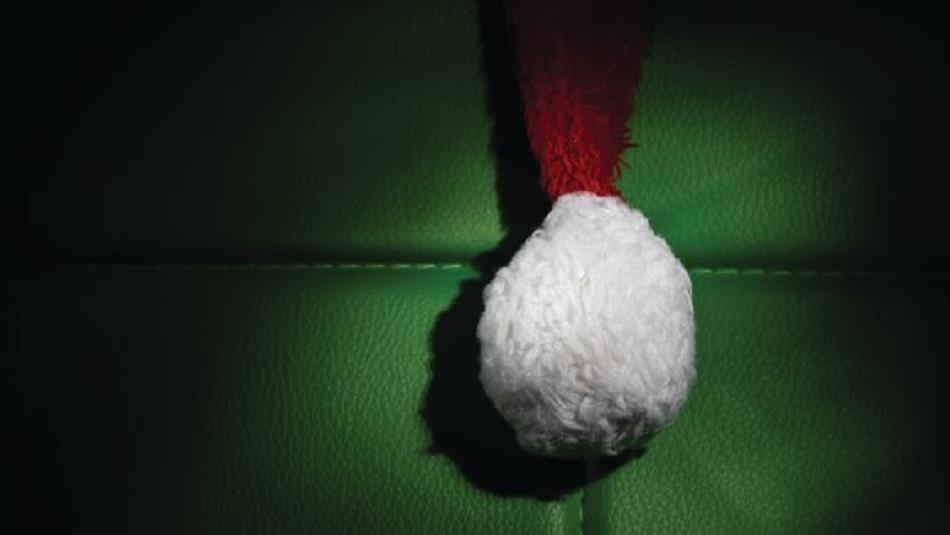 Santa's hat against a green background.