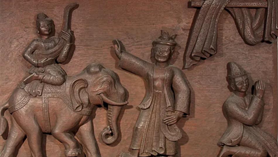 A wooden carving of a scene from the Ramayana.